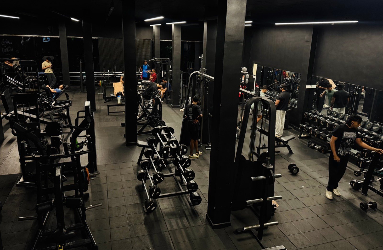 The Premium Fitness floor seen from above, with benches and dumbbell racks